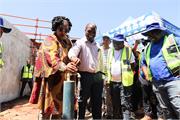 Minister Pemmy Majodina with Deputy Minister Seitlholo opening a tap at uMshwathi Bulk Water Supply Scheme construction site